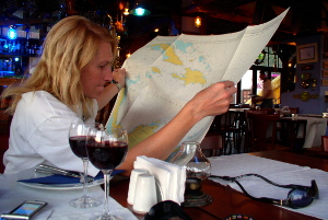 Meg Aitken with navigational chart of the Caribbean photo elenameg.com