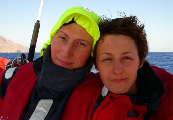 Meg Aitken and Elena Vaytsel in offshore sailing gear, take a selfie south of Crete. Photo used by the BBC photo elenameg.com